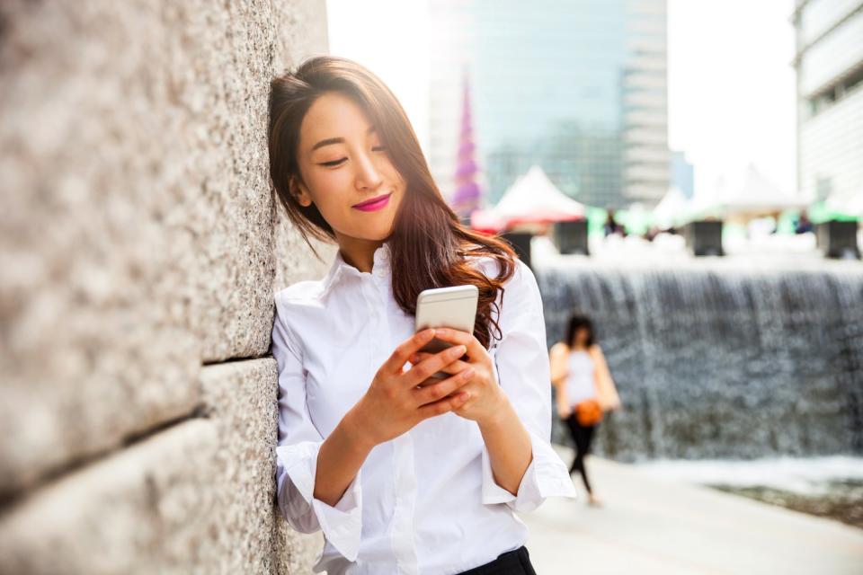 Person using a smartphone outside.