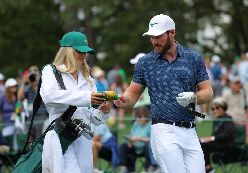 © Reuters. Grayson Murray and Christiana Ritchie, April 10, 2024. REUTERS/Brian Snyder