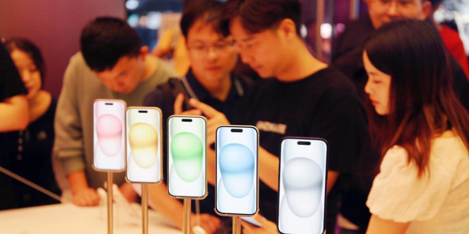 The iPhone 15 on display at an event.