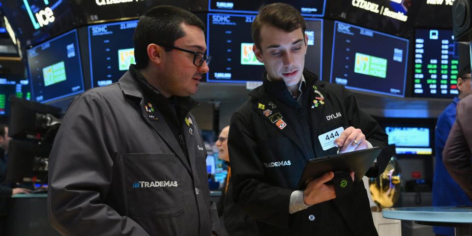 Traders work on the floor of the New York Stock Exchange (NYSE) during morning trading on January 11, 2024 in New York City.