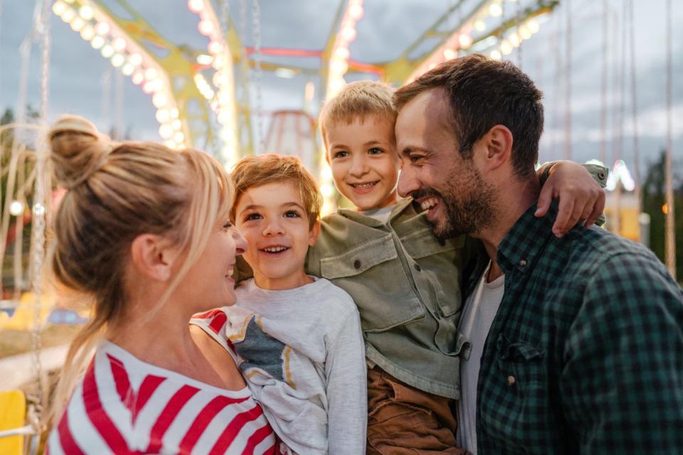 A family at an amusement park.