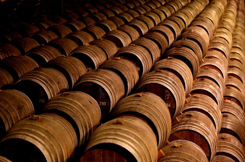 © Reuters. FILE PHOTO: Oak barrels are stored in a cellar used for storing rare and old cognac at the Remy Martin factory in Cognac, France, November 21, 2018. REUTERS/Regis Duvignau/File Photo