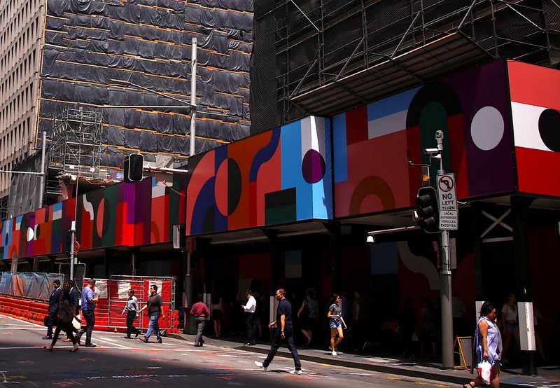 © Reuters. FILE PHOTO: Buildings being renovated and under construction can be seen near shoppers as they walk along a street in the central business district (CBD) of Sydney in Australia, February 13, 2018.   REUTERS/David Gray/File Photo