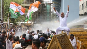 Police use water cannons to disperse Congress workers during their protest demanding the resignation of SEBI chief Madhabi Buch and a JPC probe into the Adani issue, in front of the Enforcement Directorate’s (ED) office, in Bhopal, Thursday, Aug. 22, 2024. (PTI Photo)